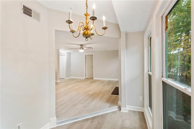 4315 Orchard Park Ct, Stone Mountain, GA 30083 - spare room with a chandelier, wood finished floors, baseboards, and a ceiling fan