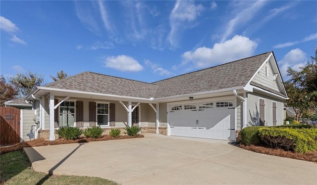 ranch-style house featuring a garage and covered porch