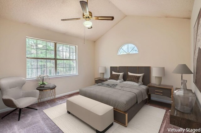 2068 Bedford Ct, Lithonia, GA 30058 - bedroom with baseboards, ceiling fan, lofted ceiling, carpet flooring, and a textured ceiling