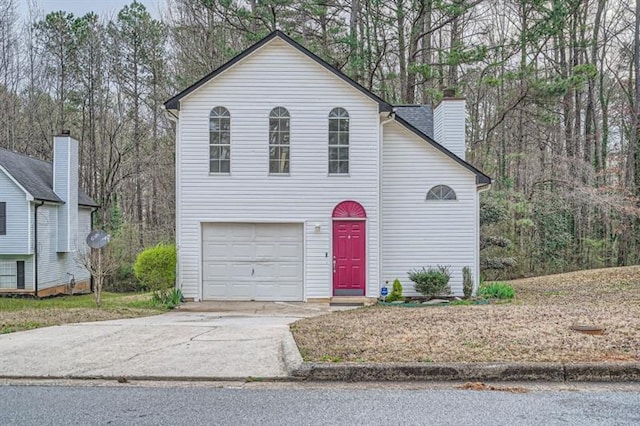 2068 Bedford Ct, Lithonia, GA 30058 - traditional-style home with driveway and a chimney
