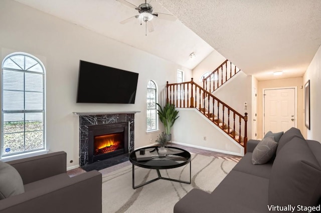 2068 Bedford Ct, Lithonia, GA 30058 - living room with stairway, a wealth of natural light, and ceiling fan