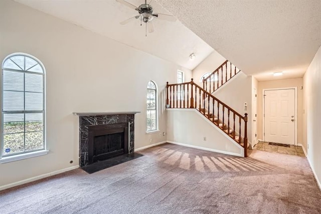 2068 Bedford Ct, Lithonia, GA 30058 - unfurnished living room featuring carpet flooring, lofted ceiling, and baseboards