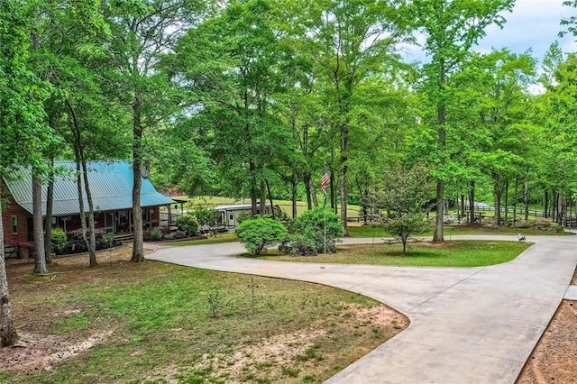 surrounding community featuring curved driveway