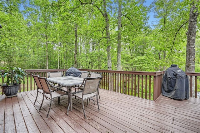 wooden deck with outdoor dining area