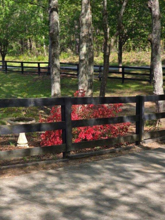 view of gate with fence