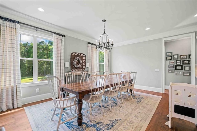 829 Christopher Rd, Sharpsburg, GA 30277 - dining space with a chandelier, baseboards, wood finished floors, ornamental molding, and recessed lighting