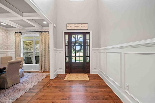 829 Christopher Rd, Sharpsburg, GA 30277 - entryway with a decorative wall, a wainscoted wall, healthy amount of natural light, wood finished floors, and beamed ceiling