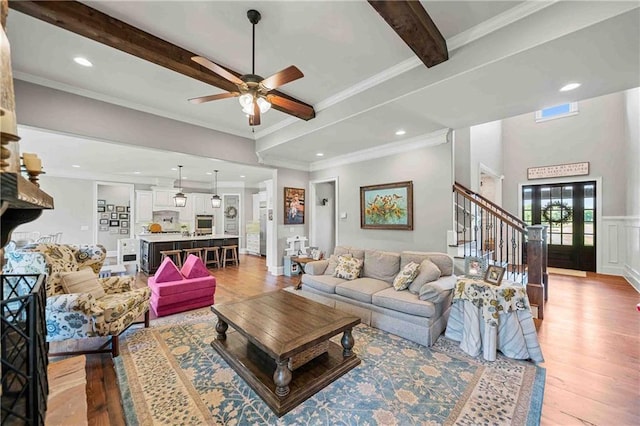 829 Christopher Rd, Sharpsburg, GA 30277 - living room featuring light wood-style floors, stairs, beam ceiling, a ceiling fan, and recessed lighting