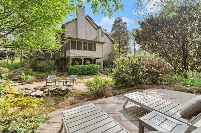 3749 Watkins Pl NE, Brookhaven, GA 30319 - view of patio / terrace featuring stairway and a sunroom