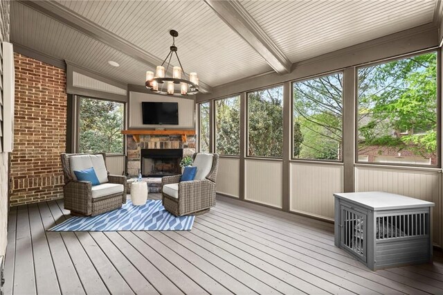 3749 Watkins Pl NE, Brookhaven, GA 30319 - sunroom with a fireplace, a chandelier, healthy amount of natural light, and beam ceiling
