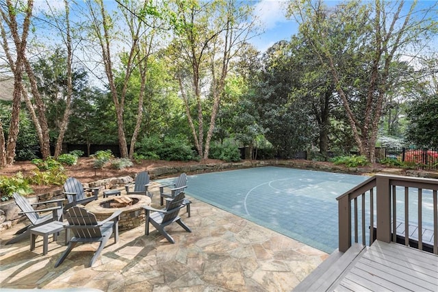 3749 Watkins Pl NE, Brookhaven, GA 30319 - view of swimming pool with a fire pit, a patio, and view of scattered trees