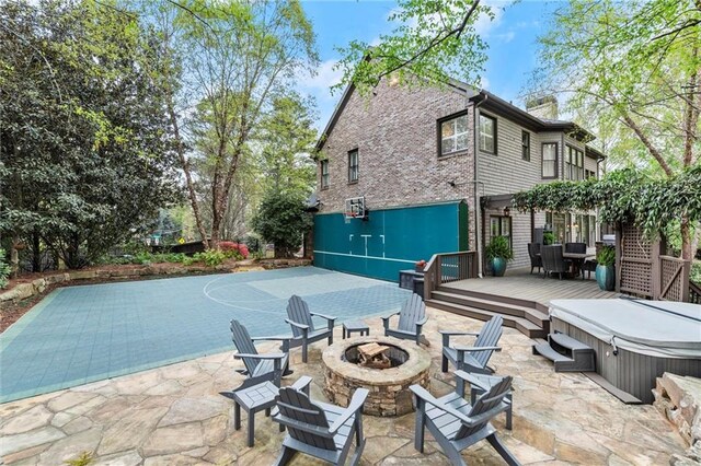 3749 Watkins Pl NE, Brookhaven, GA 30319 - view of patio with an outdoor fire pit, a hot tub, and a deck