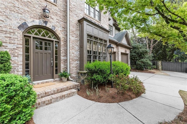 3749 Watkins Pl NE, Brookhaven, GA 30319 - property entrance featuring brick siding, driveway, and an attached garage