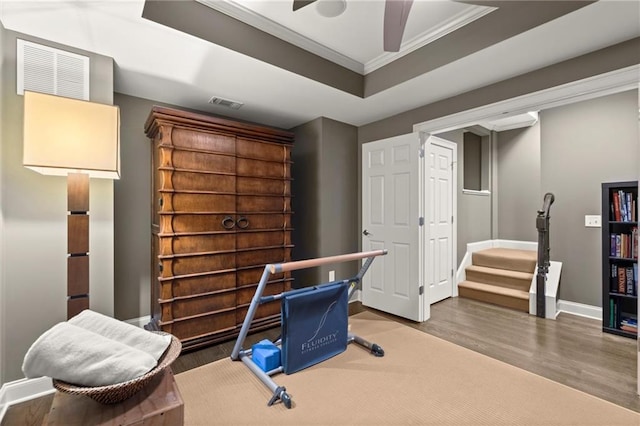 3749 Watkins Pl NE, Brookhaven, GA 30319 - office area featuring wood finished floors, baseboards, crown molding, ceiling fan, and a raised ceiling