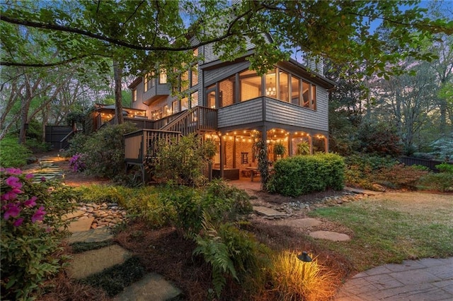 3749 Watkins Pl NE, Brookhaven, GA 30319 - back of house with stairs, a patio, and a sunroom