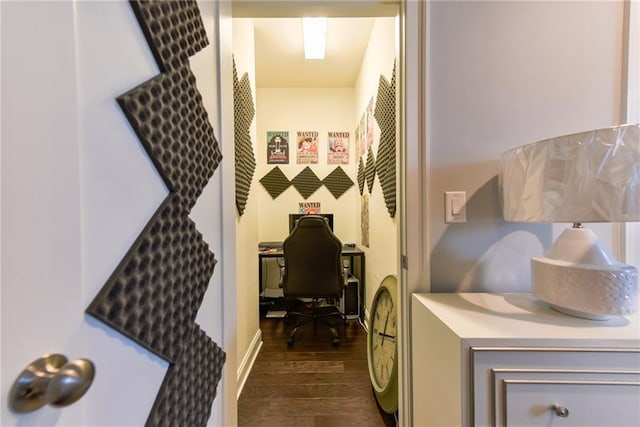 interior space featuring washer and clothes dryer, laundry area, and dark wood-style flooring