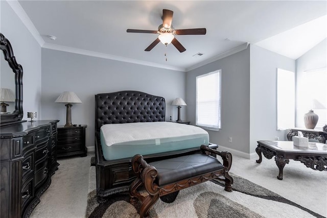 bedroom with visible vents, baseboards, light colored carpet, a ceiling fan, and ornamental molding