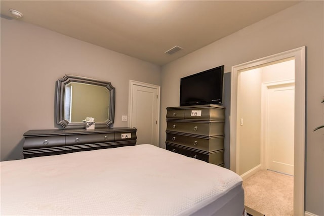 bedroom with visible vents, baseboards, and carpet flooring