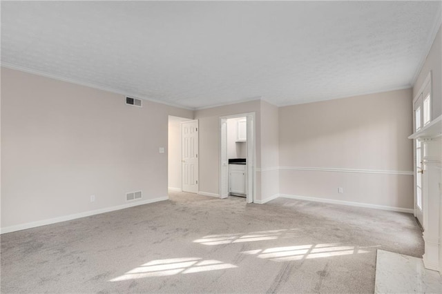 carpeted empty room with crown molding