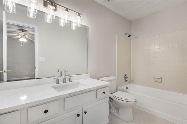 full bathroom with toilet, tiled shower / bath, a textured ceiling, vanity, and ceiling fan