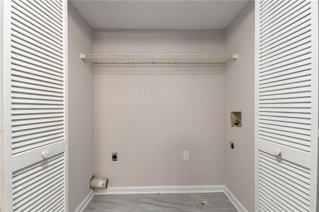 clothes washing area featuring electric dryer hookup and hookup for a washing machine