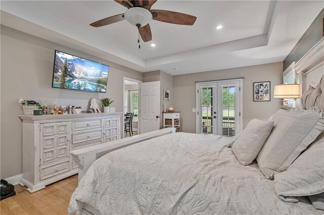 166 Woodford Way SE, Calhoun, GA 30701 - bedroom featuring access to outside, light wood-style floors, a tray ceiling, french doors, and baseboards