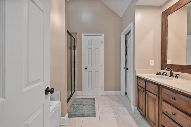 166 Woodford Way SE, Calhoun, GA 30701 - full bathroom with vanity, a shower stall, a closet, vaulted ceiling, and a tub to relax in