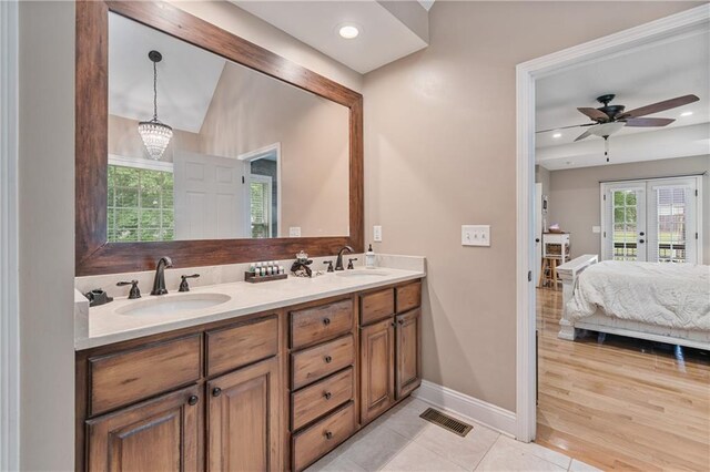 166 Woodford Way SE, Calhoun, GA 30701 - full bathroom featuring french doors, double vanity, ensuite bath, baseboards, and a ceiling fan