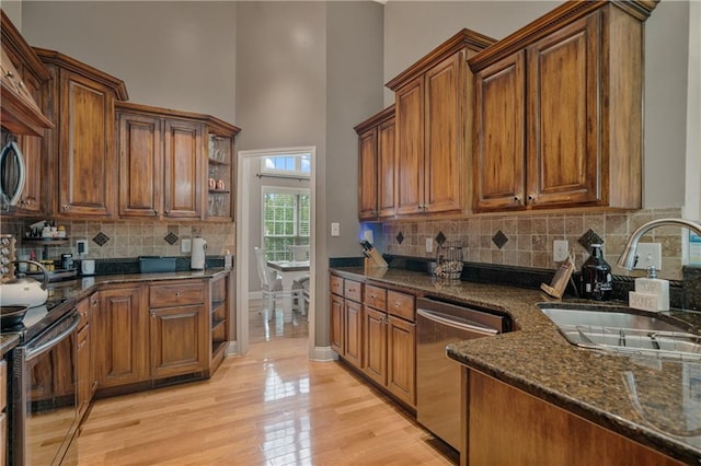 166 Woodford Way SE, Calhoun, GA 30701 - kitchen featuring dishwasher, a sink, electric stove, open shelves, and a towering ceiling