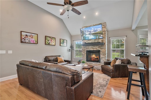 166 Woodford Way SE, Calhoun, GA 30701 - living room with a fireplace, healthy amount of natural light, ceiling fan, light wood finished floors, and high vaulted ceiling
