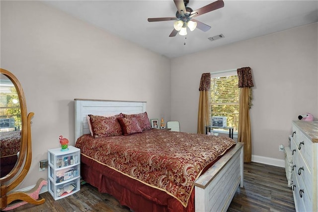 bedroom with ceiling fan, dark hardwood / wood-style floors, and multiple windows