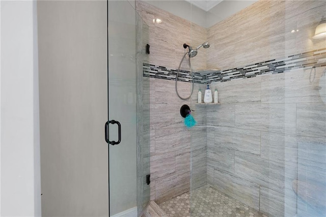 bathroom with a shower with shower door