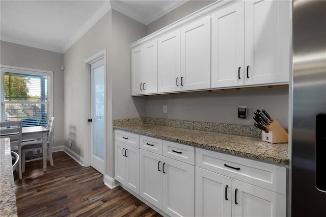 kitchen featuring ornamental molding, light stone countertops, stainless steel fridge with ice dispenser, and white cabinets