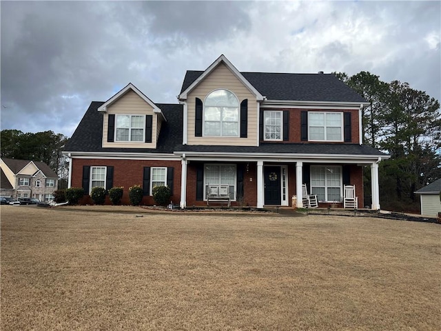 view of front of home featuring a porch and a front yard