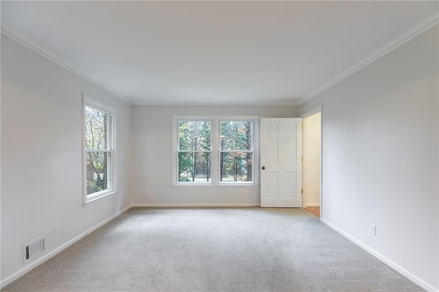 unfurnished room with light carpet and ornamental molding