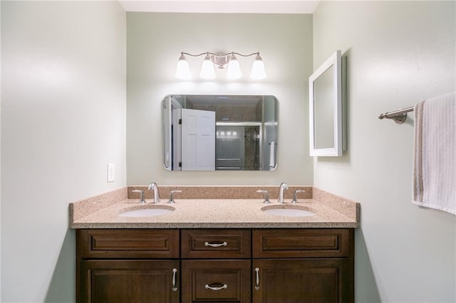 bathroom with an enclosed shower and vanity