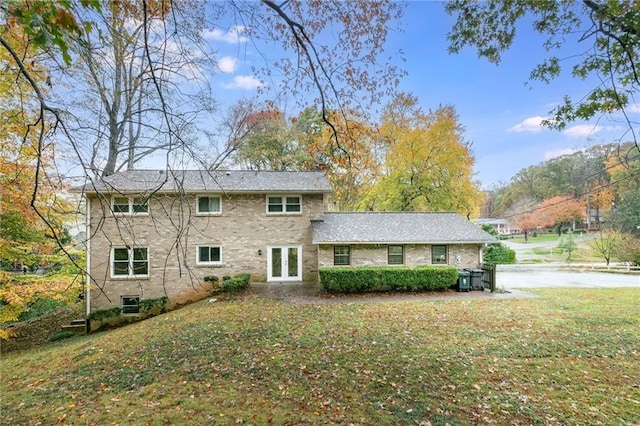 back of house with a yard