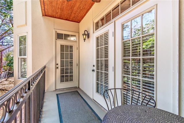 property entrance with stucco siding