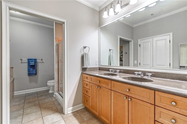 bathroom featuring crown molding, a sink, and a shower stall