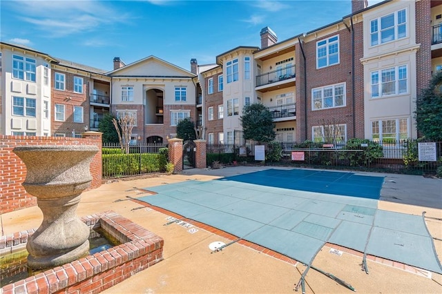 view of swimming pool with fence