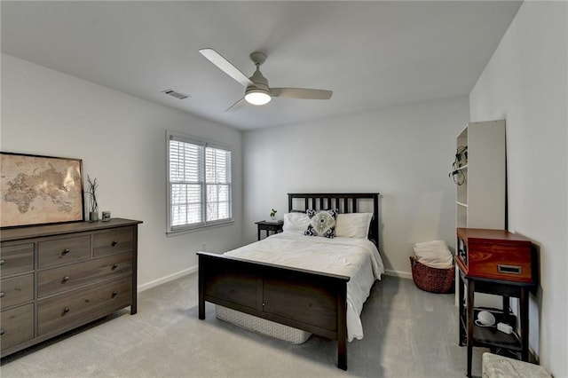 bedroom with ceiling fan and light carpet