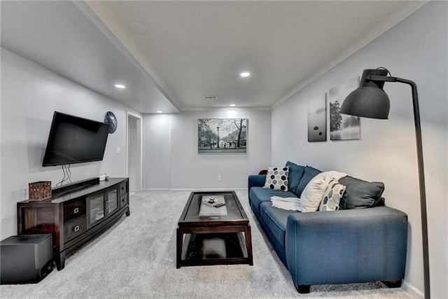 carpeted living room with ornamental molding