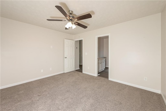 113 Garden Walk, Stockbridge, GA 30281 - unfurnished bedroom featuring carpet flooring, connected bathroom, and a ceiling fan