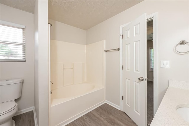 113 Garden Walk, Stockbridge, GA 30281 - bathroom featuring wood finished floors, vanity, tub / shower combination, and a textured ceiling