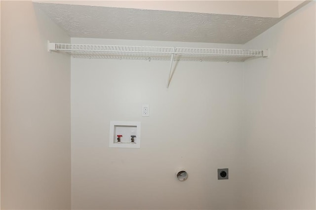 113 Garden Walk, Stockbridge, GA 30281 - laundry room with hookup for an electric dryer, washer hookup, and a textured ceiling