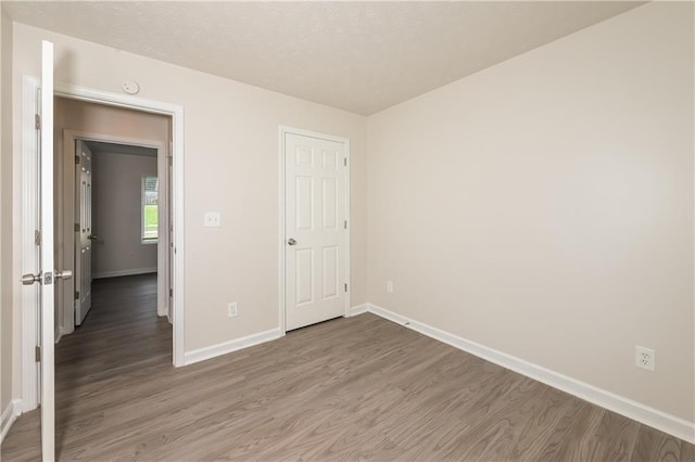 113 Garden Walk, Stockbridge, GA 30281 - unfurnished bedroom with wood finished floors and baseboards
