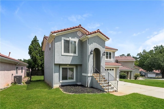 113 Garden Walk, Stockbridge, GA 30281 - mediterranean / spanish-style house featuring a garage, driveway, stucco siding, and a tiled roof