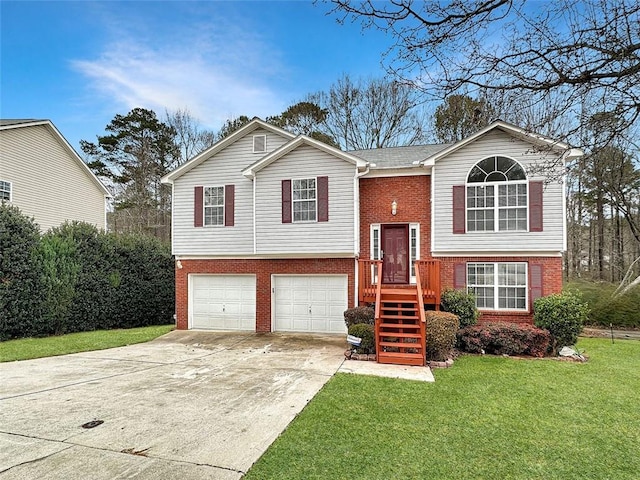 bi-level home with a garage and a front lawn