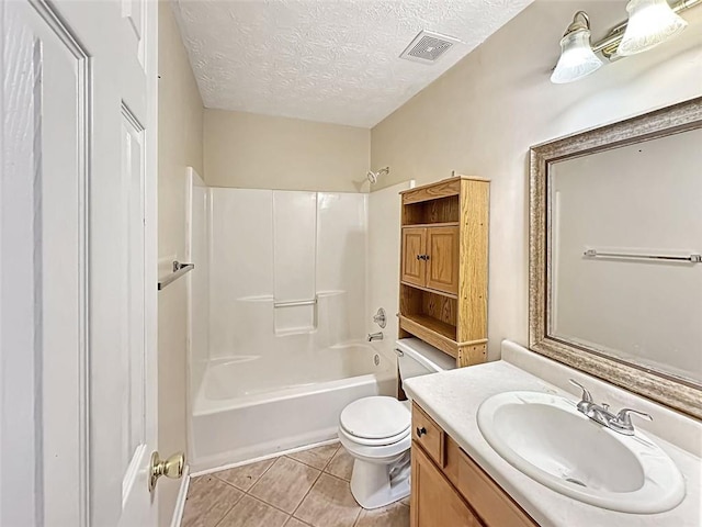 full bathroom with vanity, bathtub / shower combination, tile patterned flooring, toilet, and a textured ceiling