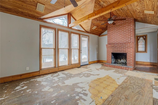 unfurnished living room with lofted ceiling with beams, a brick fireplace, and ceiling fan